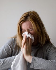 woman blowing nose - homebiotic