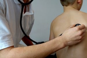 doctor checking boy with stethoscope - Homebiotic - mold illness