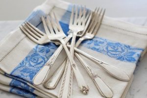 pile of forks on napkins - Homebiotic - 5 carcinogens in cleaning products